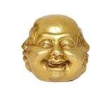 Smiling brass Buddha head decor, close-up mouth and laugh lines