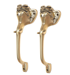 Golden brass Ganesha face door handles, side view with curved grip and base holes