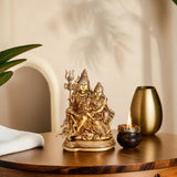 Brass Shiv Parivar Idol, golden metal; central Shiva with trident and seated companions