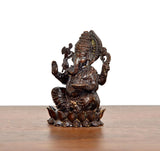 Lord Ganesha brass idol side view, raised hand with ornamental staff, lotus base