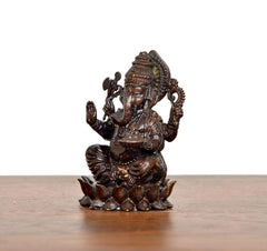 Lord Ganesha brass idol side view, raised hand with ornamental staff, lotus base