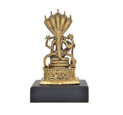 Rear view of Vishnu idol with multi-hood canopy, decorative base and gold-tone finish