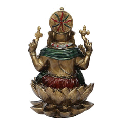 Back view Ganesha sculpture, gold body with green cloth and red decorative accents