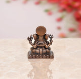 Rear view of copper Ganesha idol with circular halo and beaded back detail