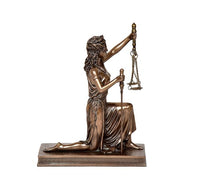Resin Lady Justice seated figurine holding scales aloft and sword, bronze-toned base