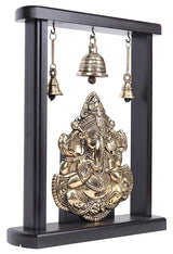 Brass Ganesha idol figurine in dark wooden frame with four hanging bells