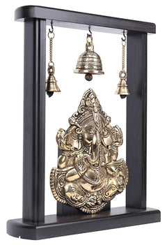 Brass Ganesha idol figurine in dark wooden frame with four hanging bells