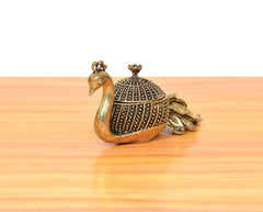 Brass duck-shaped kumkum box with patterned dome lid and curled peacock-side detail