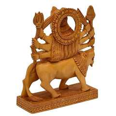 Wooden Durga showpiece with circular halo and trident arms, on lion figure base