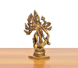 Brass Durga idol angled view, trident and many arms, ornate jewelry, 5 in