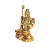 Brass Shiva idol statue side view, trident upright, seated lotus base