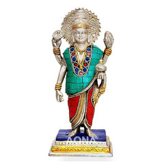 Silver brass Dhanvantri statue in teal and red with gold detailing, raised hands