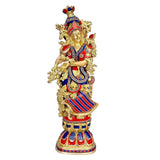 Brass Radha Rani sculpture, seated-style pose with patterned red, blue and gold dress.