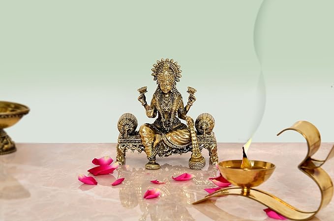 Brass Lakshmi idol, seated blessing pose on pedestal, 4-inch height