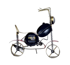 Metal bicycle statue with dark blue clock face, red highlights, spring and wheel details