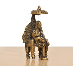 Brass Shirdi Sai Baba statue, side view with praying pose and umbrella top