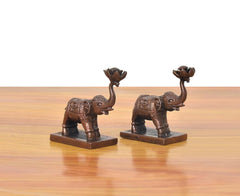 Copper elephant figurines set of 2, profile view with textured body and pedestal