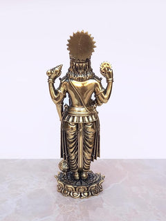 Brass Lord Vishnu idol statue back view with tall crown and draped garments on base