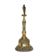 Brass pooja bell side view with decorative bands on base and ribbed handle