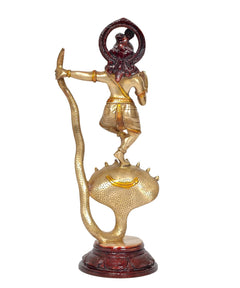 Brass Krishna statue on Kaliya serpent, raised arm and dark red halo details