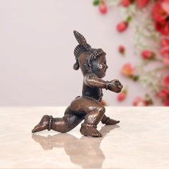 Bal Gopal Krishna laddu idol, sideways crawling pose, dark copper finish