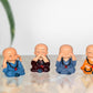 Resin Buddha Monk Set of 4 Statue Smilling Little Buddha Monk Figurines Showpiece Buddha Idol Statue for Table Decor Living Room Home Car Dashboard (Height: 2 Inch)