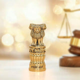 Ashoka Stambh in brass tone with lion figure on pedestal, 4 inch height.