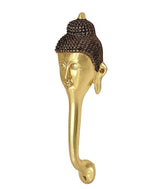 Gold-tone Buddha face door handle with side earlobes and dark hair cap