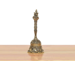Bronze pooja bell with Garun crest; filigree detailing on the top of the base.