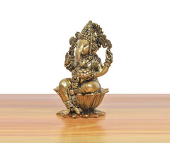 Bronze Ganapati Bappa idol, side angle showing trunk, crown details, lotus base