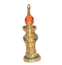 Brass peacock diya figure with painted head, gold details, round base