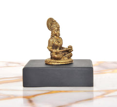Maa Annapurna Devi golden idol seated side view on black base (1.75 in)