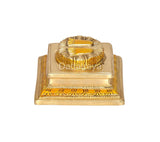 Brass-finish Lakshmi charan paduka showing sculpted footprint and trim