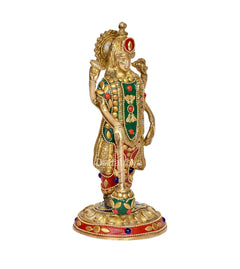 Brass Vishnu idol, standing four-armed, profile view with red gem accents on crown