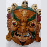 Mahakala wall hanging mask with green headband, orange face, red eyes and snarling mouth