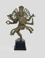 Bronze Shiva Nataraj statue in dynamic dance pose, multi-armed figure, standing on base