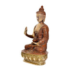Side view brass Buddha idol, Abhaya mudra raised hand, ornate pedestal base