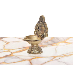 Brass oil lamp figurine of Lord Venkateshwara with raised hands, side 3/4 view