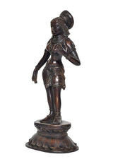 Brass Apsara statue side view, textured headdress and draped body ornaments