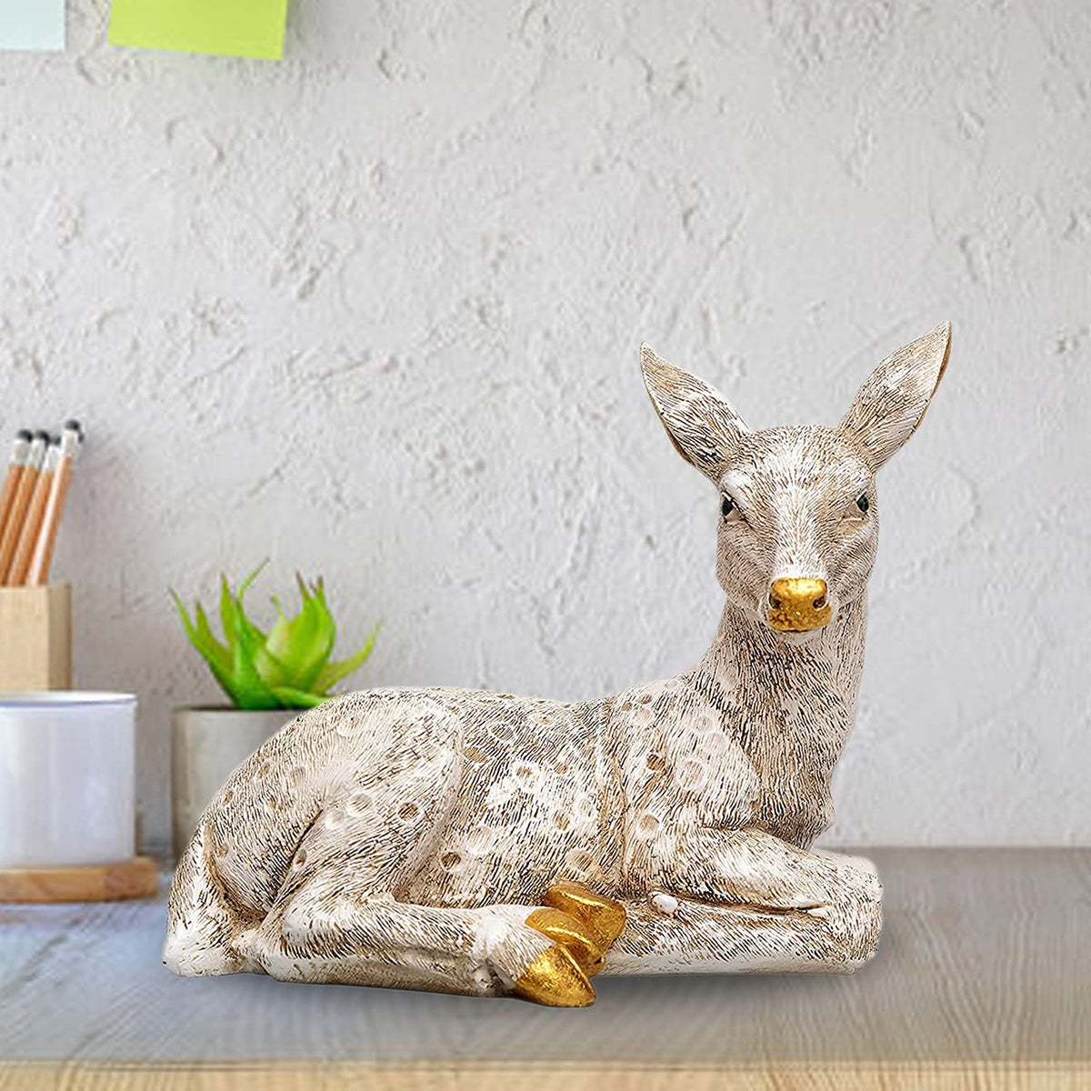 Polyresin deer figurine, resting pose with gold accents and textured speckled coat