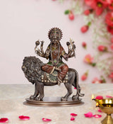 Durga statue on lion with gold-toned crown and multicolour decorative garments