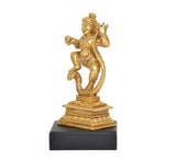 Dancing Bal Krishna brass statue from side view, coiled-leg stance, black pedestal