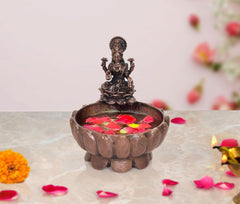Copper Lakshmi Maa urli bowl with goddess idol, holds flowers for Ganga jala