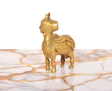 Brass Kamdhenu cow figurine, golden finish, rear-left view with tail