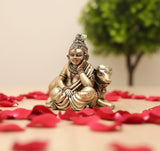 Brass Lord Bal Gopal with cow idol, seated on base, side view