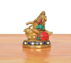 Brass Ganesha statue blowing conch shell, detailed multicolor base border