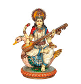 Resin Saraswati idol statue with crown, playing veena, seated on peacock