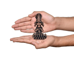 Copper Surya Dev Rath miniature statue in hands, front view, ornate seven-horse base