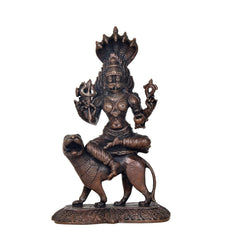 Pratyangira Devi copper statue on ornate base, seated posture with trident-like weapon