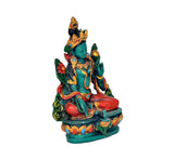 Green Tara resin statue from side: teal figure, gold headpiece, red seat accents